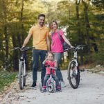 family-with-bicycle-summer-park_1157-33543