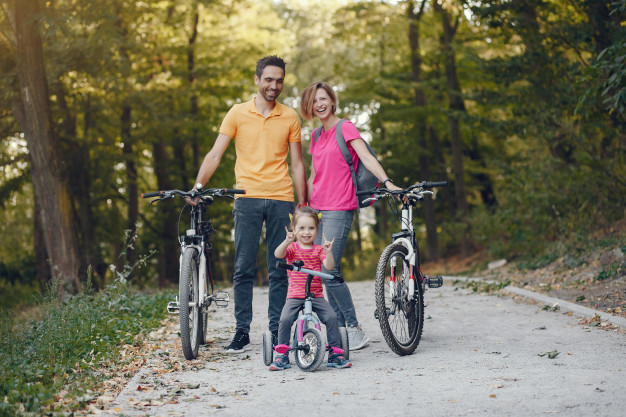 family-with-bicycle-summer-park_1157-33543