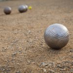 petanque-balls-sandy-pitch-with-other-metal-ball-background_155027-366